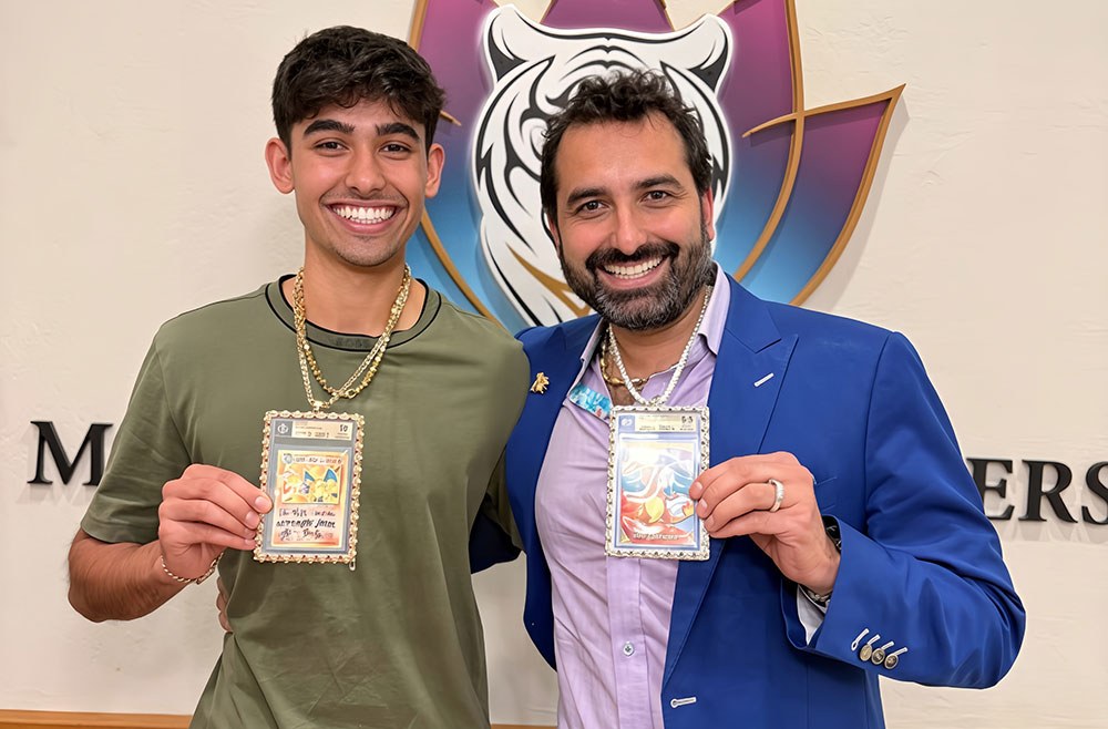 Manny Soin of Middleton Jewelers and his son Esh Soin with framed graded cards. Photo courtesy of Middleton Jewelers.