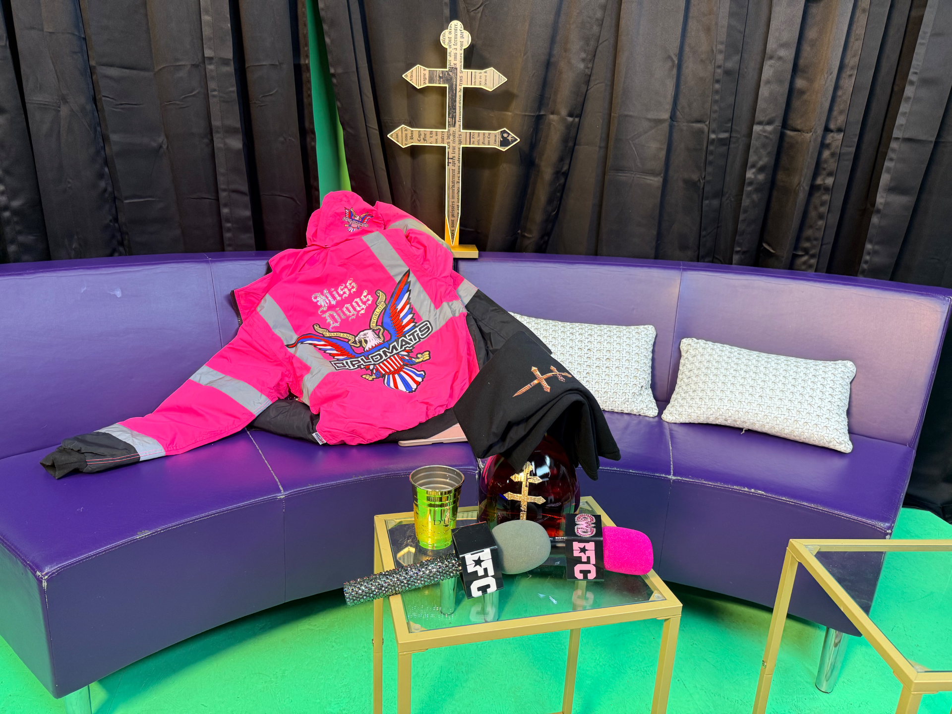 The Drip With Diggs set: Miss Diggs custom Diplomats jacket, D'USSÉ, and the pink EFC mic