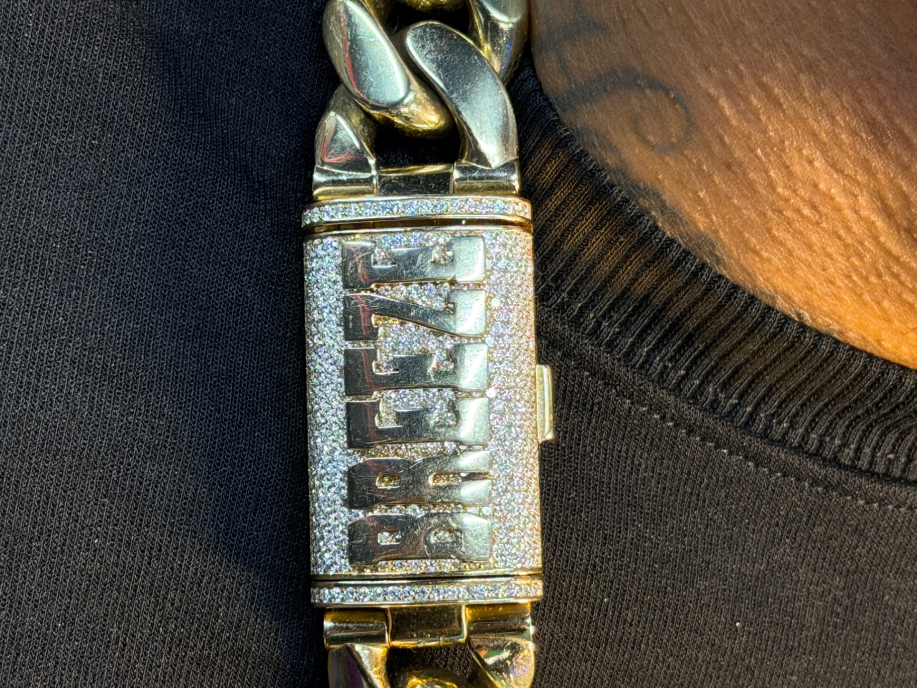 Diamond-set custom box clasp on the Cuban link chain