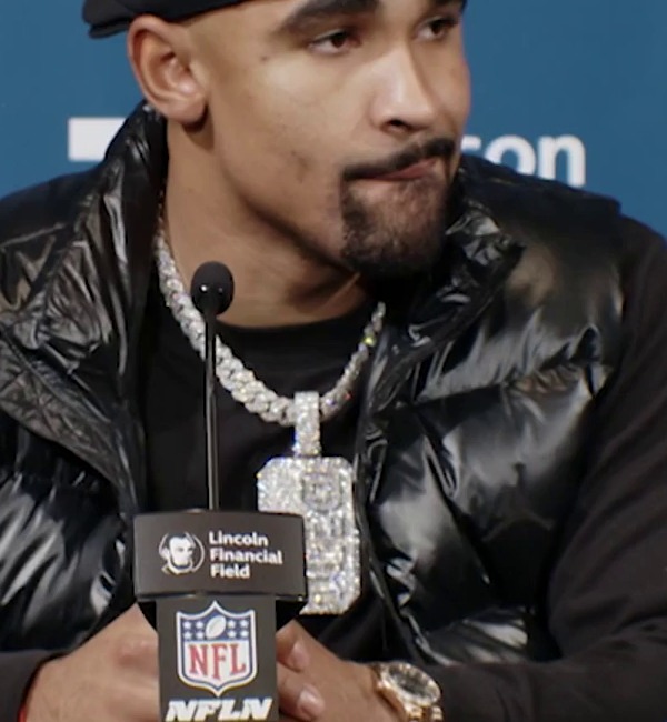Close view of Jalen Hurts wearing the Breed of One pendant at his December 15, 2024 press conference