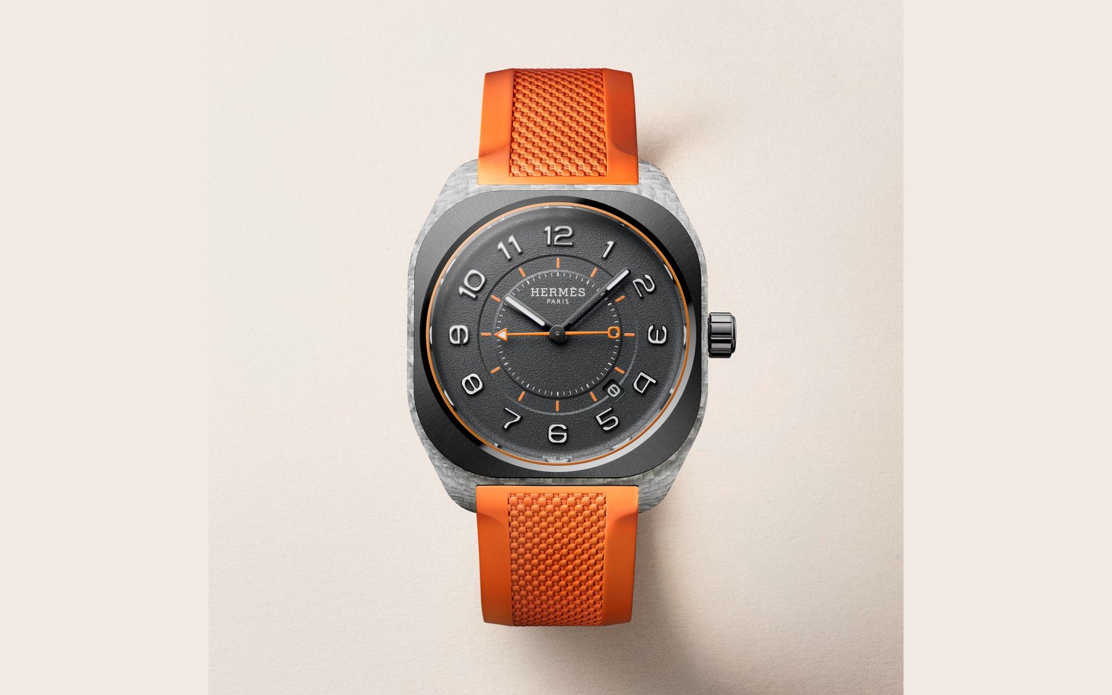 Hermès H08 watch with a graphene composite case, grey dial and orange rubber strap.