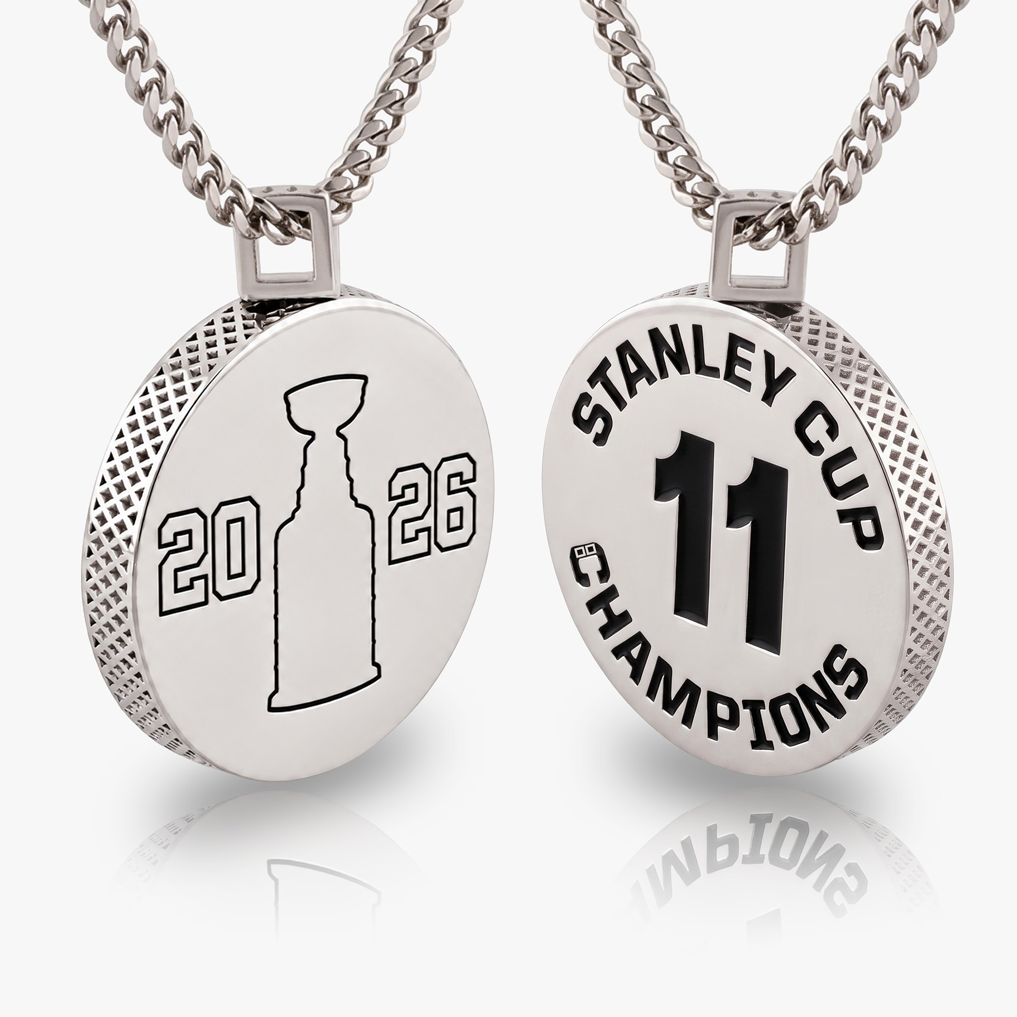 The removable puck element displayed as a pendant on a chain.