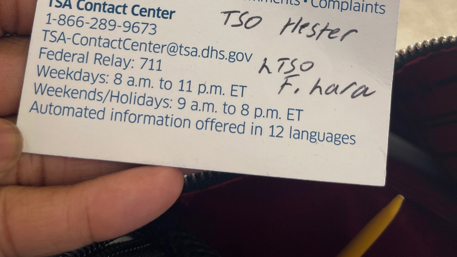 A TSA Contact Center card handed to Miss Diggs at Houston's IAH airport, with officer names written on it.
