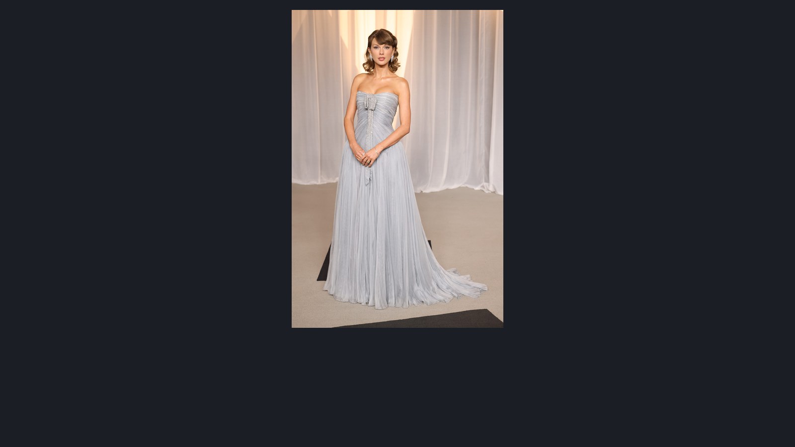 Taylor Swift in a full length pale blue strapless Dior gown with Chopard diamond earrings, bracelet and ring at the 2026 Academy Museum Gala