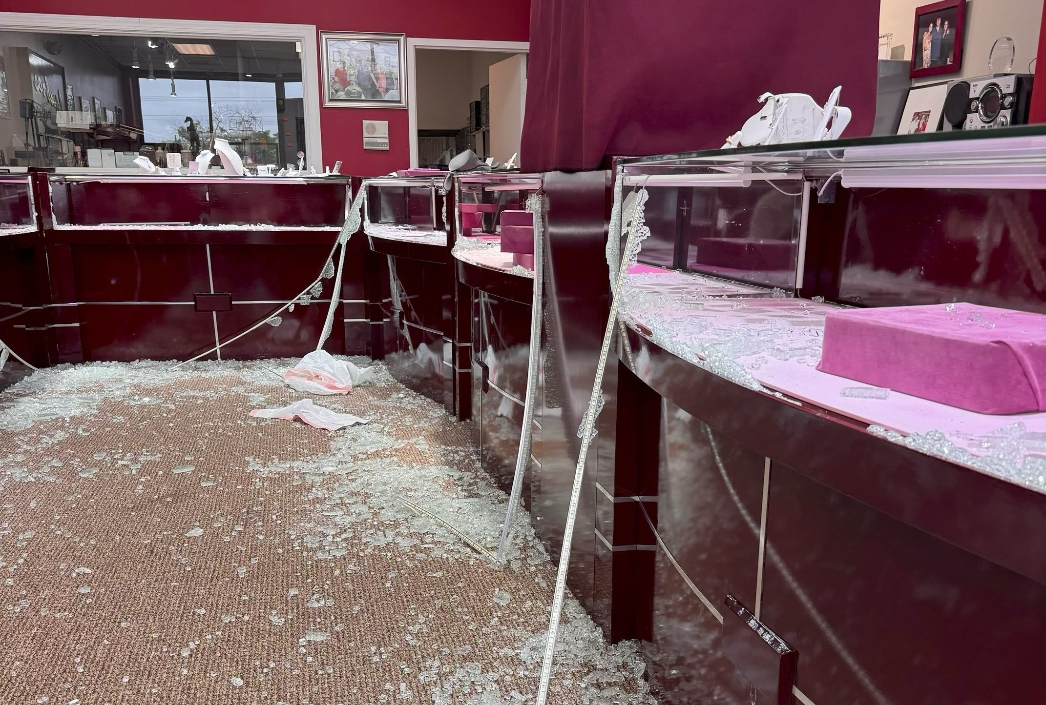 Broken glass and damaged jewelry display cases inside Lambros Goldsmith in Annandale, Virginia.
