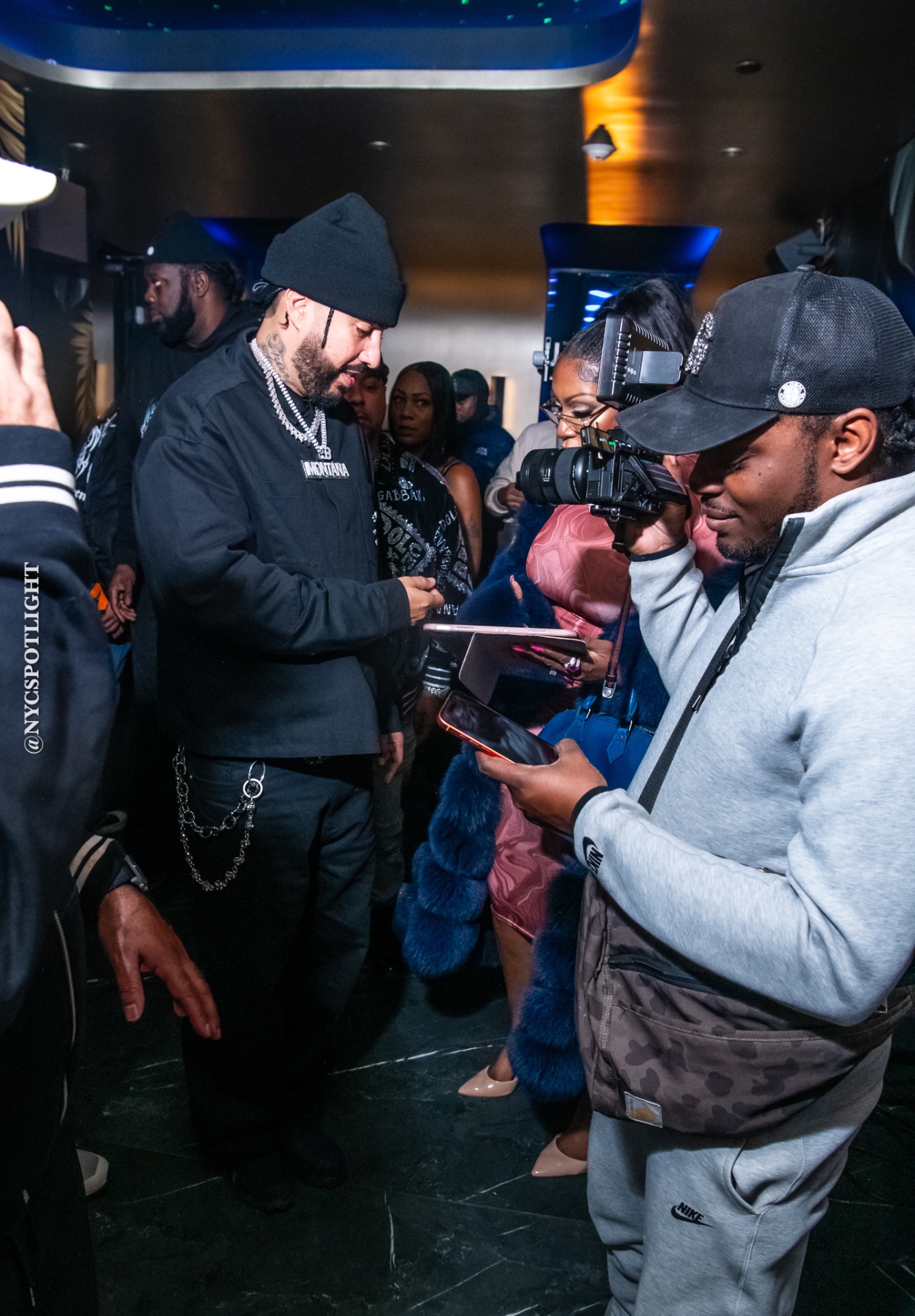 Ms. Diggs covering French Montana as media on the "Pressure" set