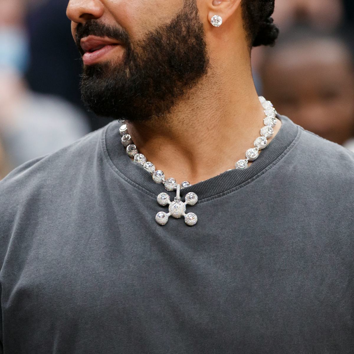 Drake wearing the one-of-one Homer Sphere Legs High Jewelry Necklace and matching bracelet courtside in March 2022. Photo: Cole Burston/Getty Images, via Inverse.