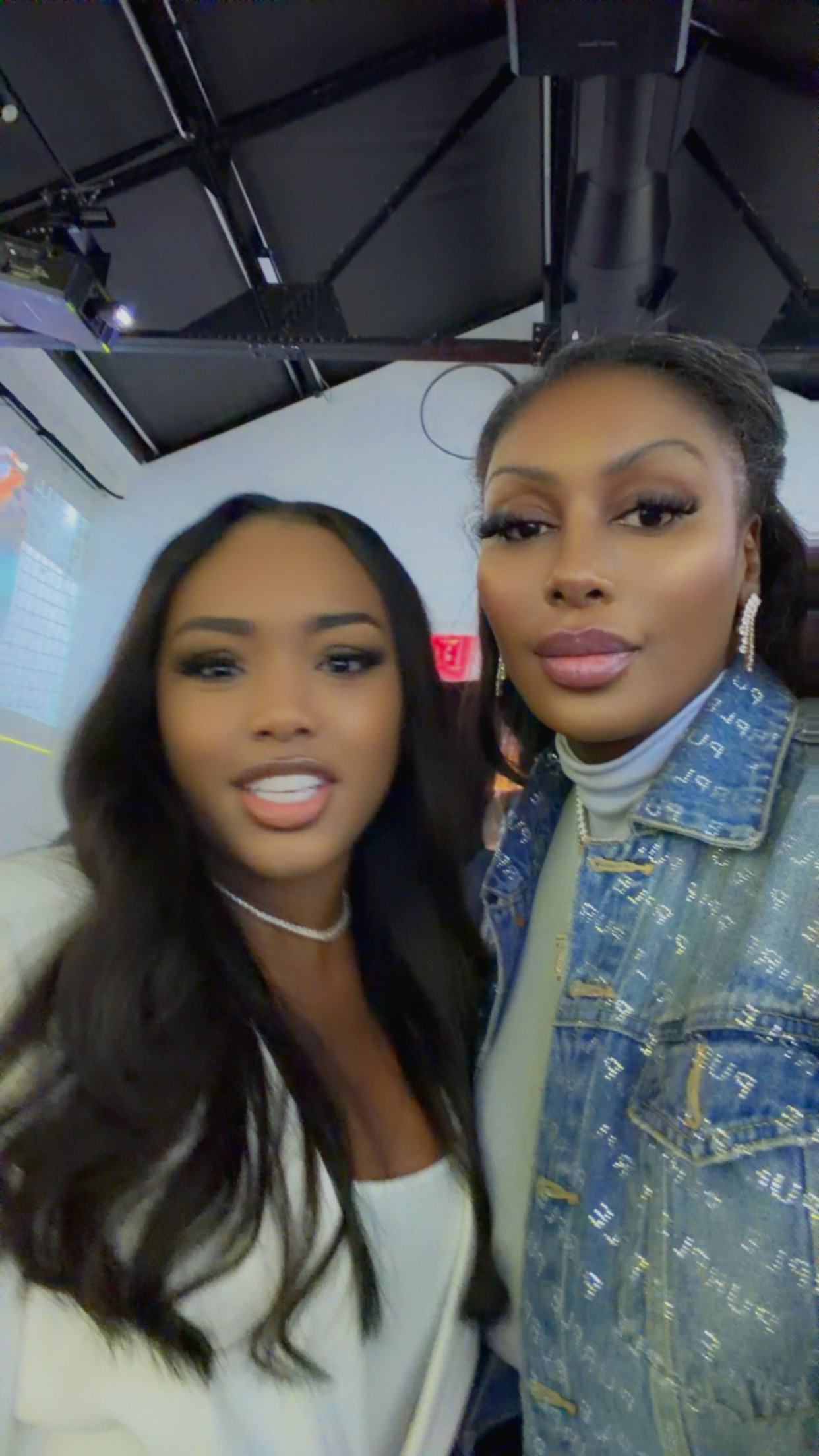 Two attendees taking a selfie at the DAZN event