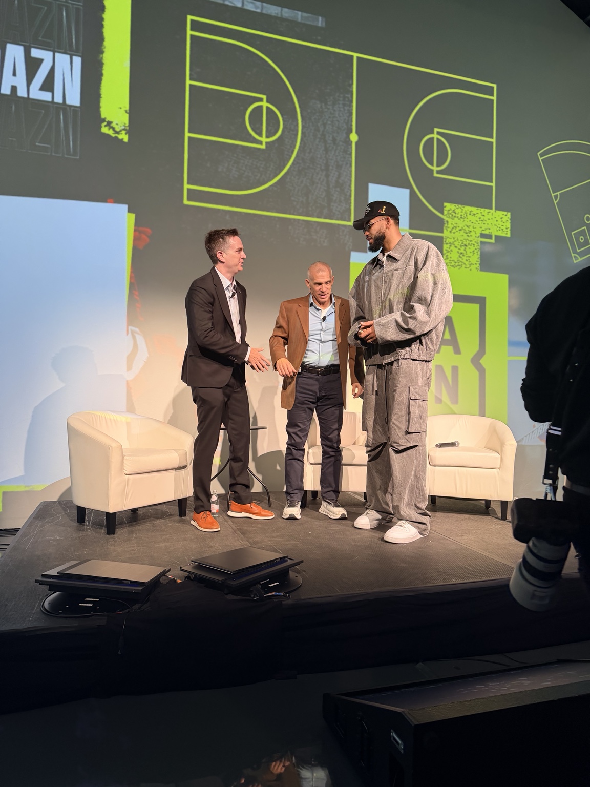 Three guests together on stage at the DAZN New York event