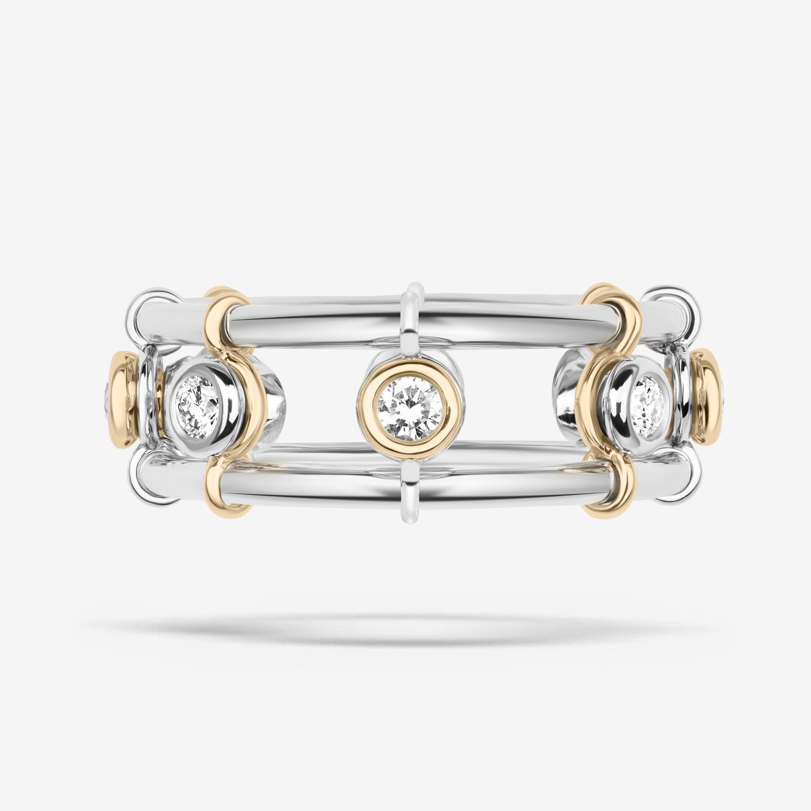 Chelsea Gabrielle Momentum Infinite ring in 18-karat white and yellow gold with eight bezel-set natural diamonds.