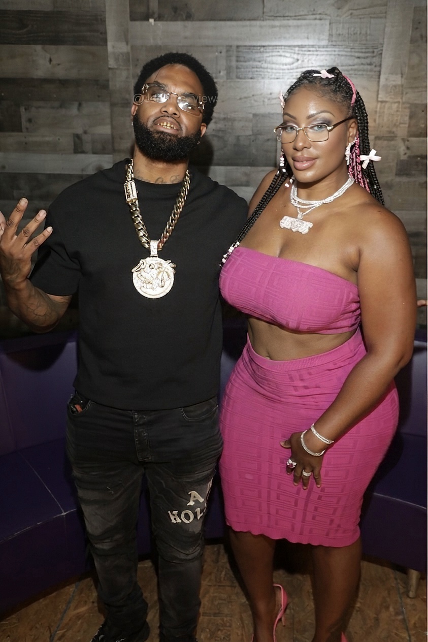 Ms. Diggs and Nino Breeze on set, Nino wearing a gold Cuban link with a diamond City of St. Petersburg pendant